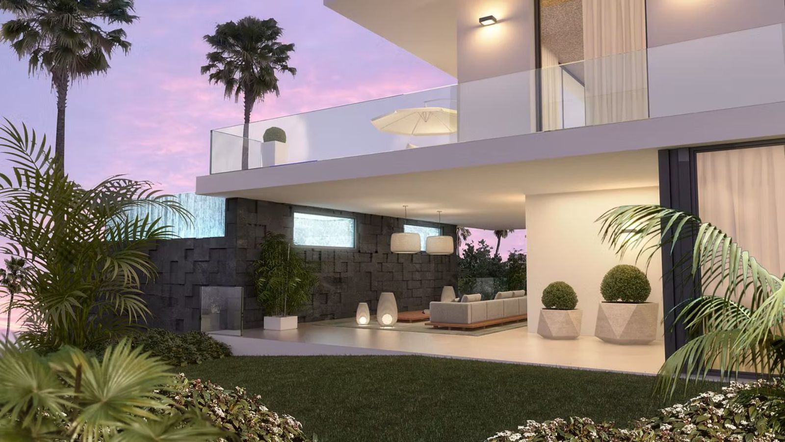 Modern living room with balcony, palm trees, and sunset view.